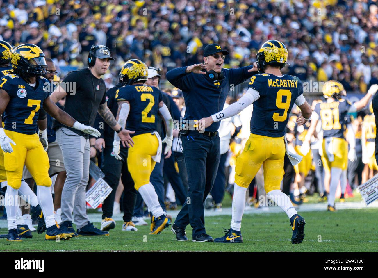 Michigan Wolverines head coach Jim Harbaugh  celebrates with quarterback J.J. McCarthy (9) during the CFP Semifinal at the Rose Bowl Game against the Stock Photo