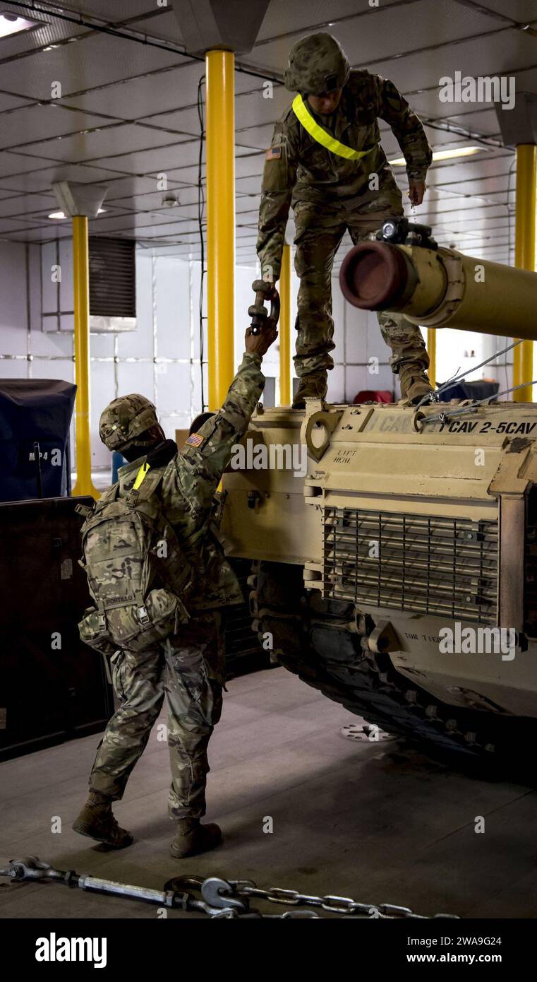 US military forces. POTI, Georgia (Aug. 22, 2018) U.S. Army Soldiers assigned to Bravo Company, 2nd Battalion, 5th Cavalry Regiment, 1st Armored Brigade Combat Team, 1st Cavalry Division work to secure an M88 HERCULES Recovery Vehicle to the deck of the Spearhead-class expeditionary fast transport ship USNS Carson City (T-EPF 7) in Poti, Georgia, Aug. 22, 2018. Carson City is the seventh of nine expeditionary fast transport ships in Military Sealift Command's inventory with a primary mission of providing rapid transport of military equipment and personnel in theater via its 20,000 square foot Stock Photo