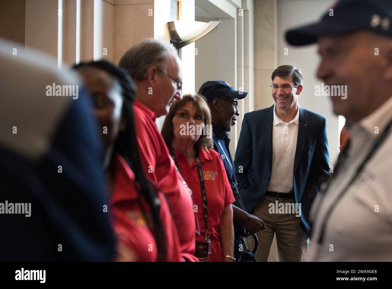 US military forces. Secretary of the Army Dr. Mark T. Esper and his wife Leah meet with Team U.S. families before the Invictus Games Sydney 2018 Opening Ceremony in Sydney, New South Wales, Australia; Oct. 20, 2018. The Invictus Games are an international adaptive sporting event with current and former wounded, ill, or injured service members from 18 nations competing in 12 adaptive sports including; archery, athletics, indoor rowing, powerlifting, road cycling, driving challenge, sailing, sitting volleyball, swimming, wheelchair basketball, wheelchair rugby, and wheelchair tennis. (DoD Photo Stock Photo