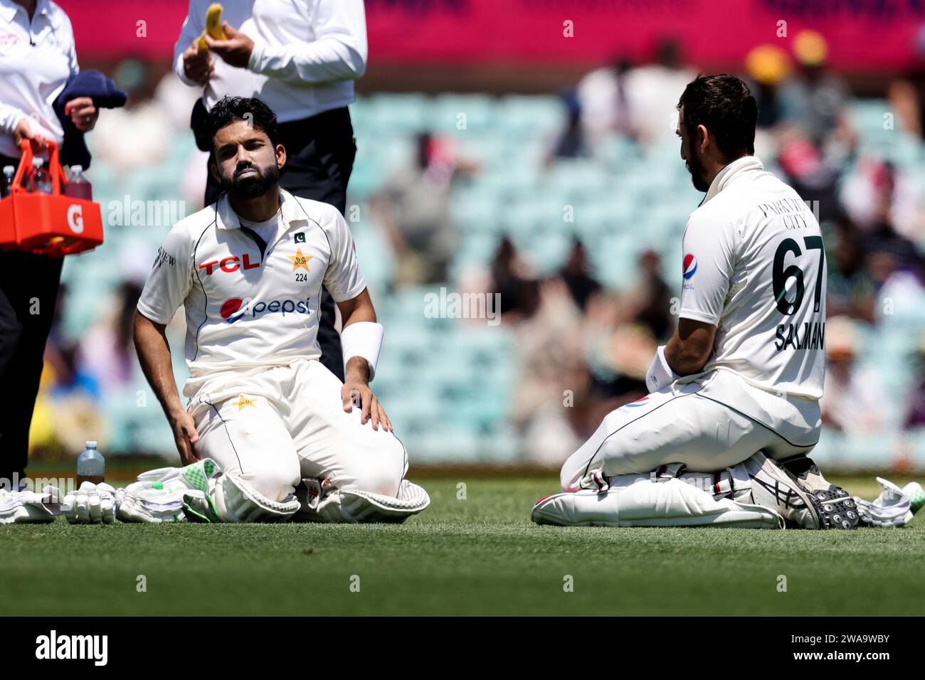 Sydney, Australia, 3 January, 2024. Mohammad Rizwan of Pakistan and Salman Ali Agha of Pakistan take a drinks break during Day 1 of the third test match between Australia and Pakistan at the Sydney Cricket Ground on January 03, 2024 in Sydney, Australia. Credit: Pete Dovgan/Speed Media/Alamy Live News Stock Photo