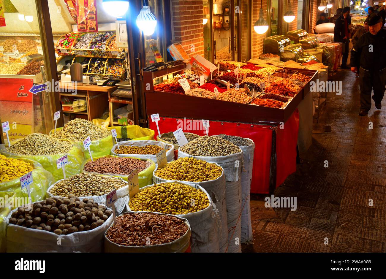 Colorful spread of dried fruits and nuts sold at the Grand Bazaar, Tehran, Iran. Stock Photo