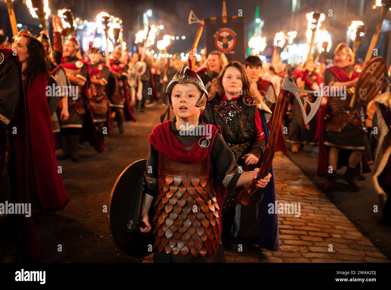 Torchlight procession led by vikings from Shetland’s South Mainland Up Helly Aa’ Jarl Squad during Hogmanay celebrations in Edinburgh, Scotland, 2023 Stock Photo