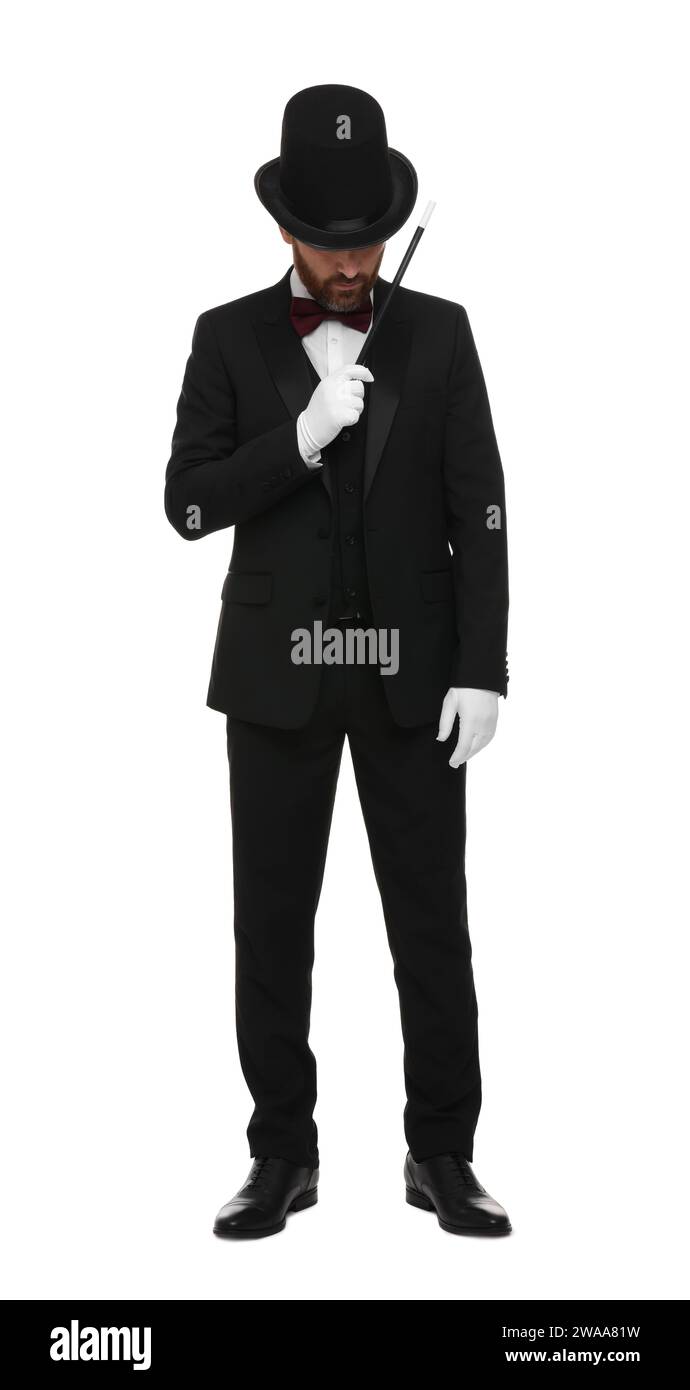 Magician in top hat holding wand on white background Stock Photo - Alamy