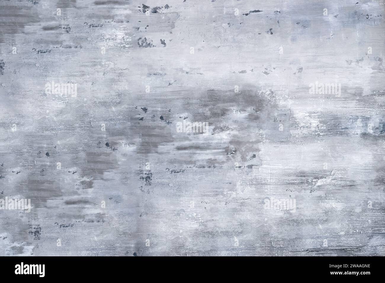 Grunge shabby concrete wall with washed and weathered white paint in daylight while showing scratches on cement construction with gray background Stock Photo
