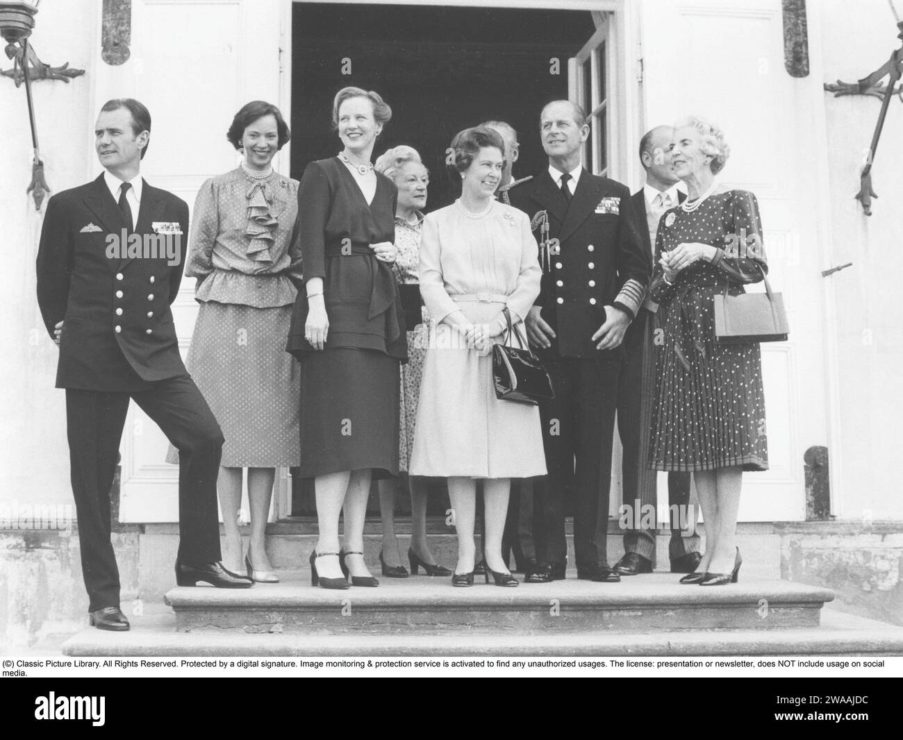 Queen Margrethe II of Denmark.  England's Queen Elizabeth II with her husband Prince Philip, Duke of Edinburgh on a state visit to Denmark in 1979 and standing with Denmark's Queen Margrethe and her husband Prince Henrik and Queen Ingrid at Fredenborg Castle Stock Photo
