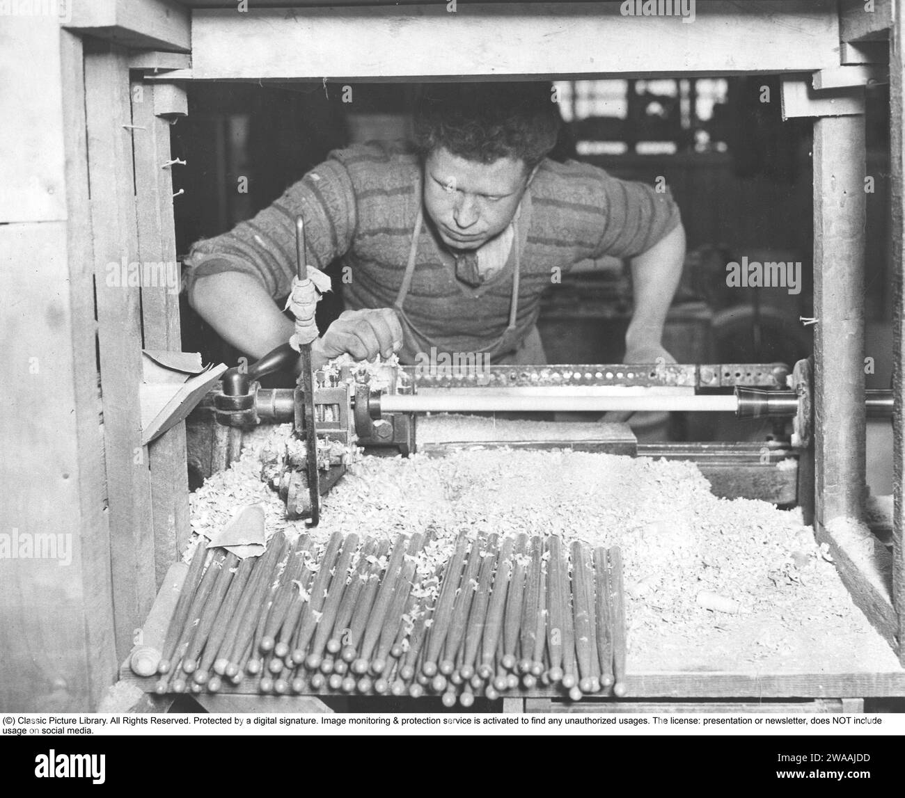 An event in 1933. A turner at his lathe finishing new drumsticks for the British Army Band. The drumsticks are made of Hickory, which is a type of wood with the right properties for the purpose. This is the first time since 1859 that drumsticks of this type of wood have been used in the British Army. 21 February 1933 Stock Photo