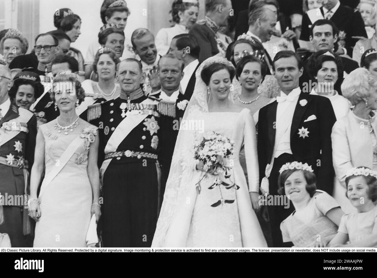 Margrethe II of Denmark. The wedding on 10 June 1967 between the then Crown Princess Margrethe and Prince Henrik. On the far left, King Gustaf VI Adolf of Sweden with sister Queen Ingrid and her husband King Frederick IX of Denmark. Behind the bride and groom can be seen Margrethe's sister Princess Bendikte and Richard of Sayn-Wittgenstein-Berleburg. At this time Margrethe was crownprincess and heir to the throne, she became Queen of Denmark 15 january 1972. Stock Photo