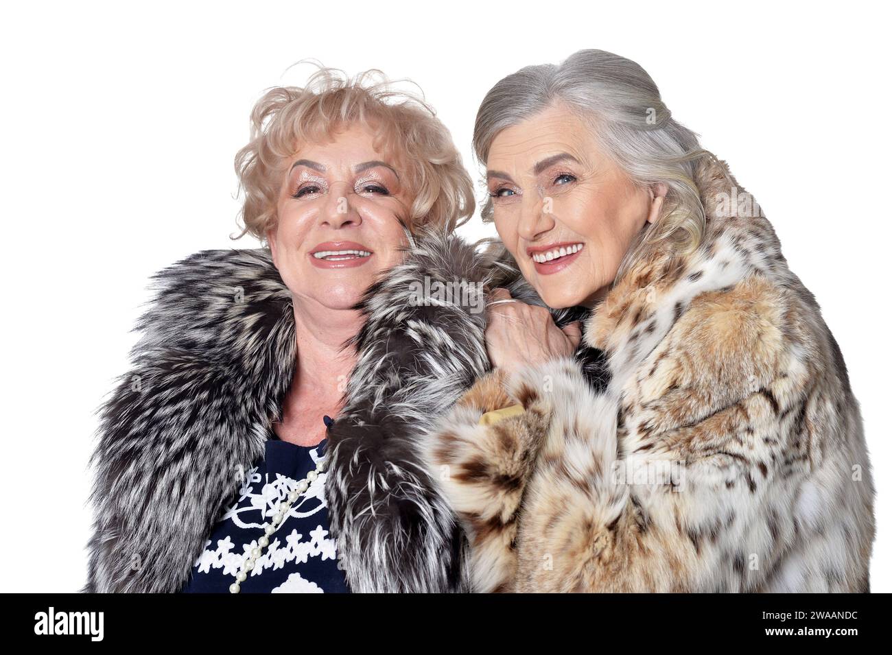 senior women in fur coats isolated on white background Stock Photo - Alamy