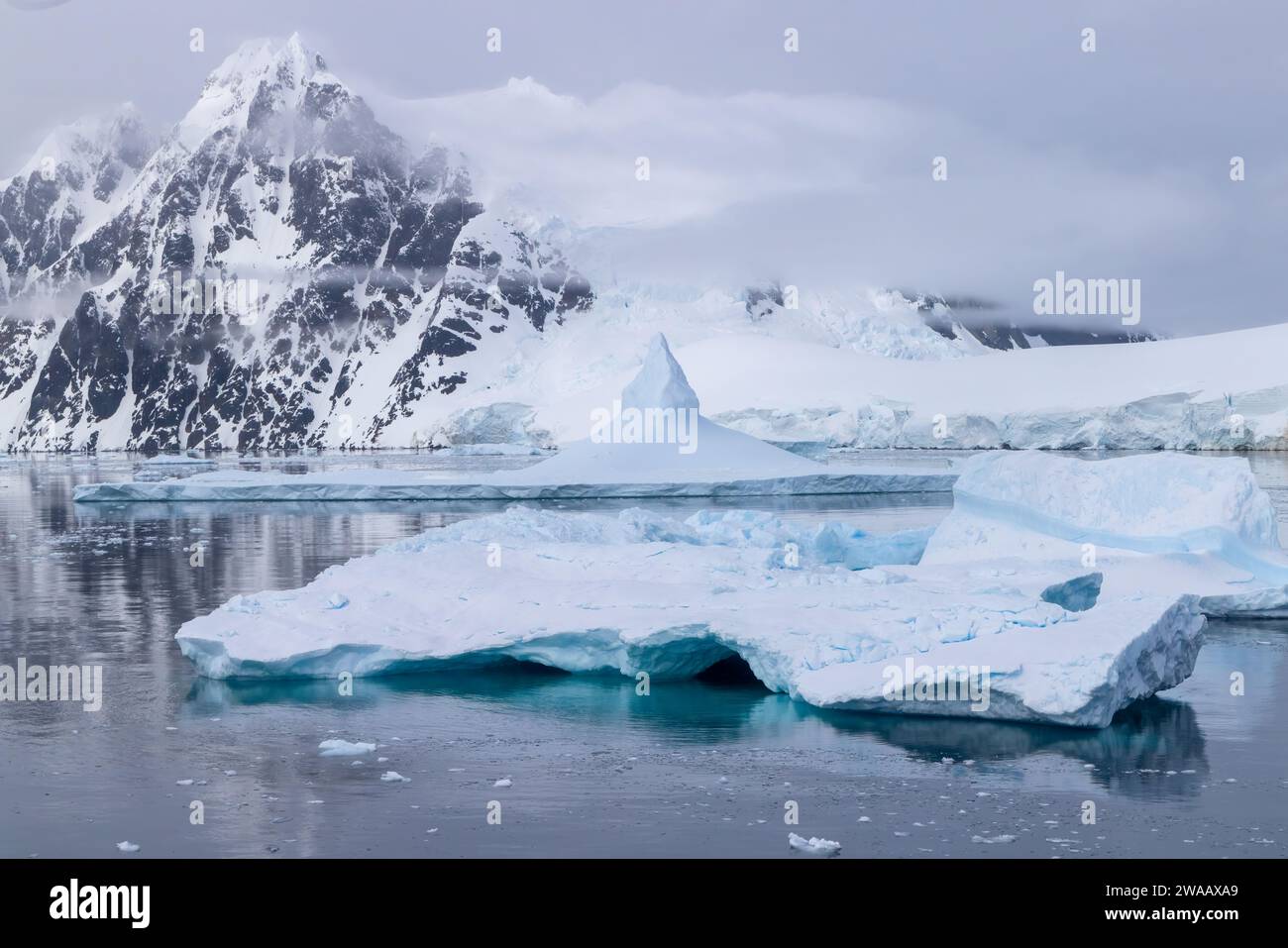 Ice, snow, and moutains near the Lemaire Channel in Antartica. Stock Photo