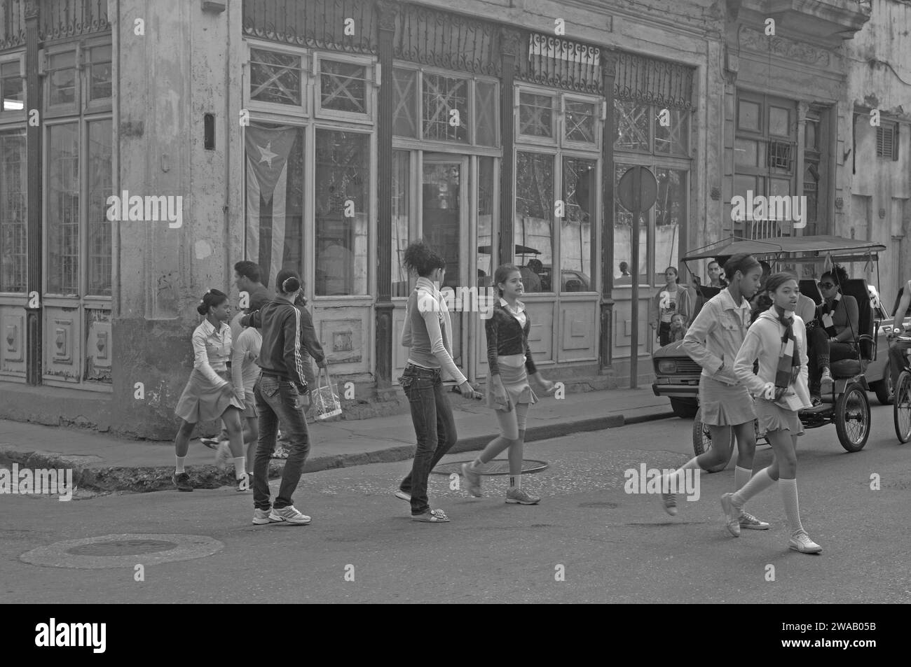 Cuba: schoolkids crossing a street in Havanna city Stock Photo