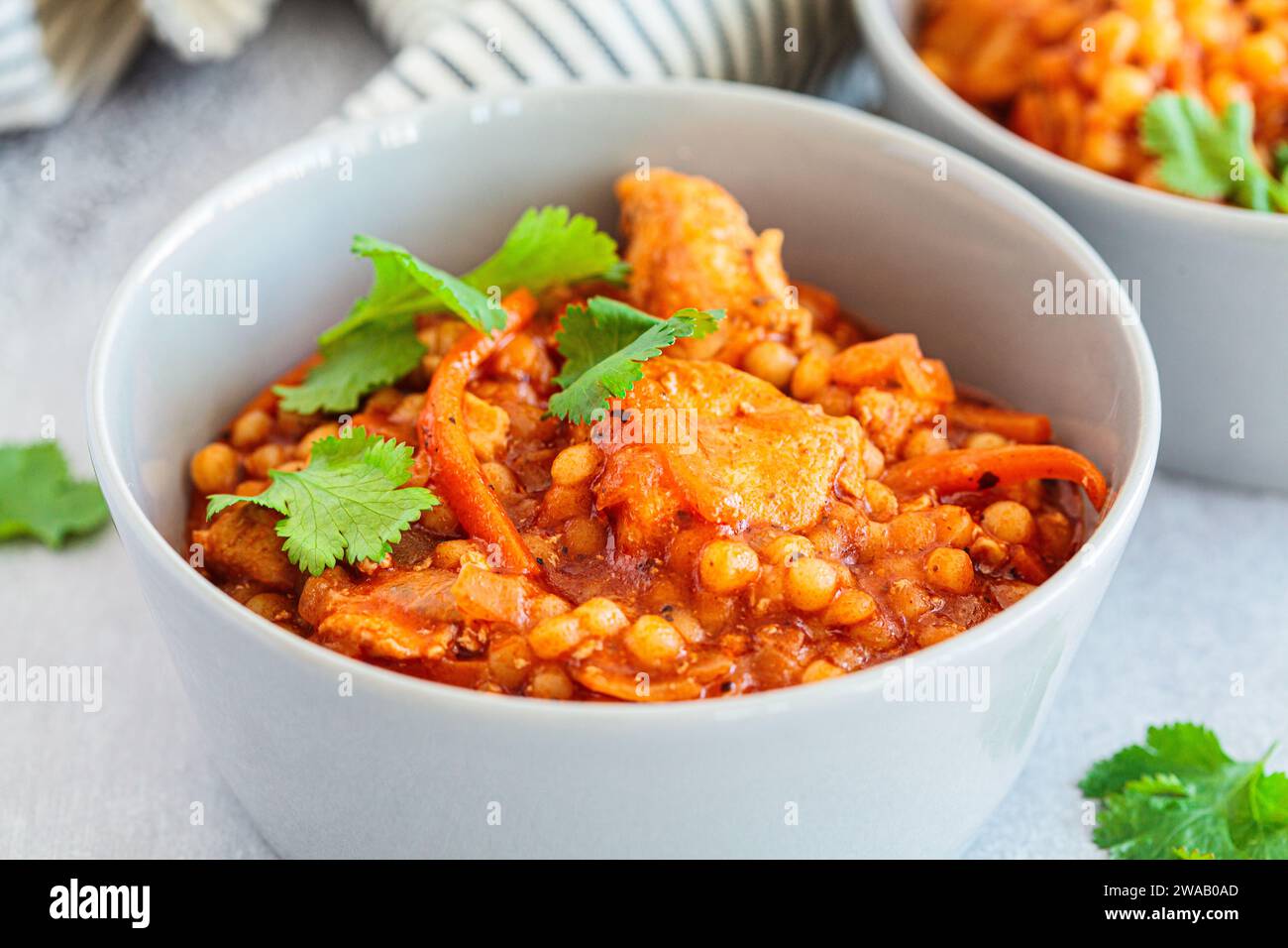 Ptitim stew with chicken and vegetables, close-up. Israeli traditional cuisine. Stock Photo