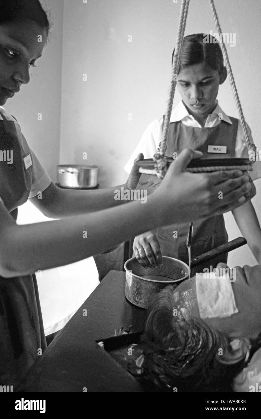 India A ayurvedic shirodhara, head massage with warm ayurvedic oil in