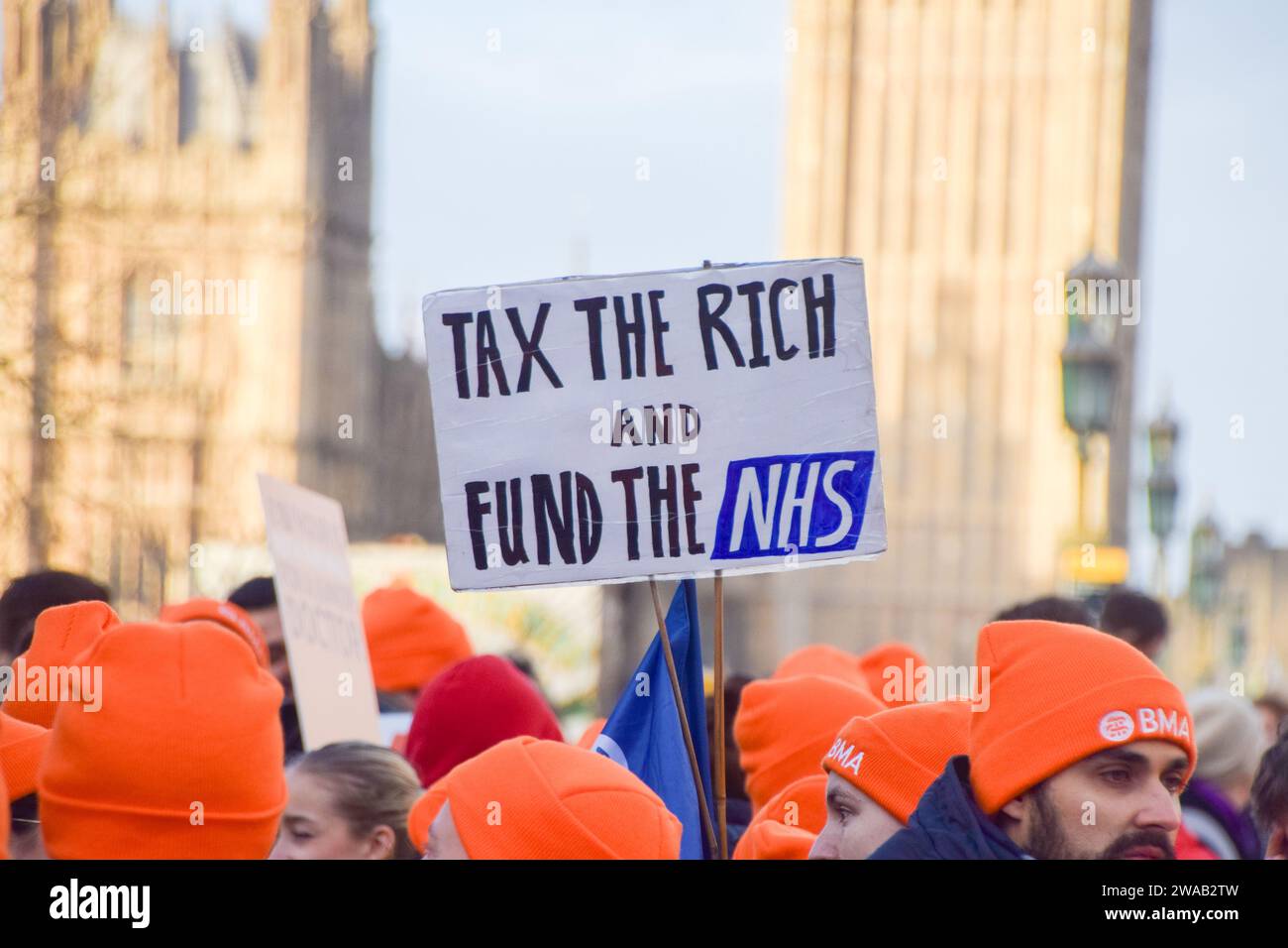 london-uk-03rd-jan-2024-a-junior-doctor-holds-a-placard-which