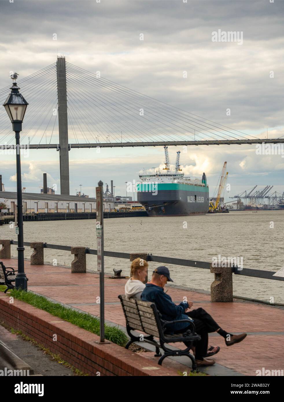large commercial ship docked on the Savannah river in Savannah Georgia Stock Photo