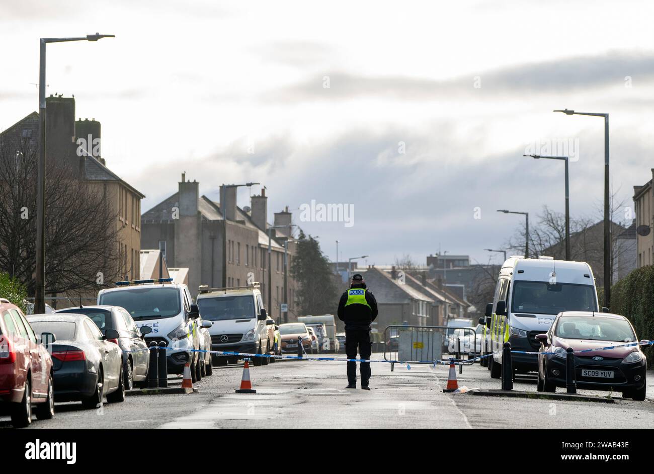 A Police cordon close to the scene near the Anchor Inn in Granton, Edinburgh, where Marc Webley, aged 38, was killed in a shooting just before midnight on New Year's Eve. Picture date: Wednesday January 3, 2024. Stock Photo