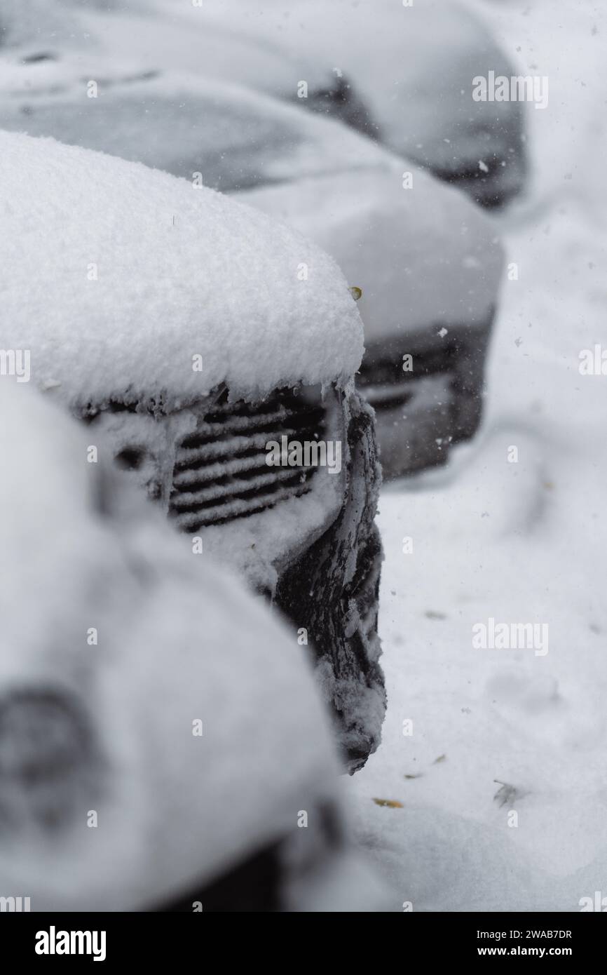 Snow-covered parked cars on a city street in winter Stock Photo - Alamy