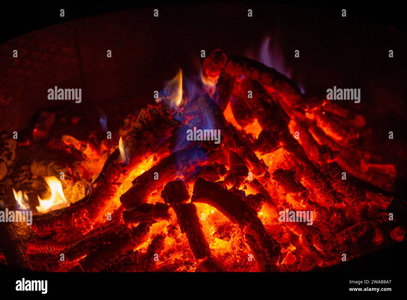 Brazier lit while wood is burning Stock Photo