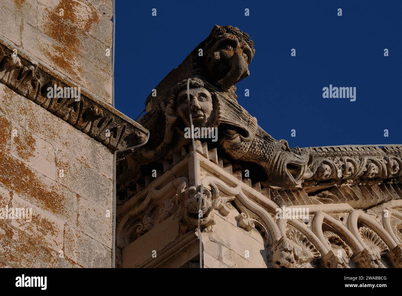 Mythical beasts, including one with a ‘trunk’, carved in stone in the 1400s on the richly decorated western gable of the Cathedral of St Mark in Korčula in Dubrovnik-Neretva county, Croatia. Stock Photo