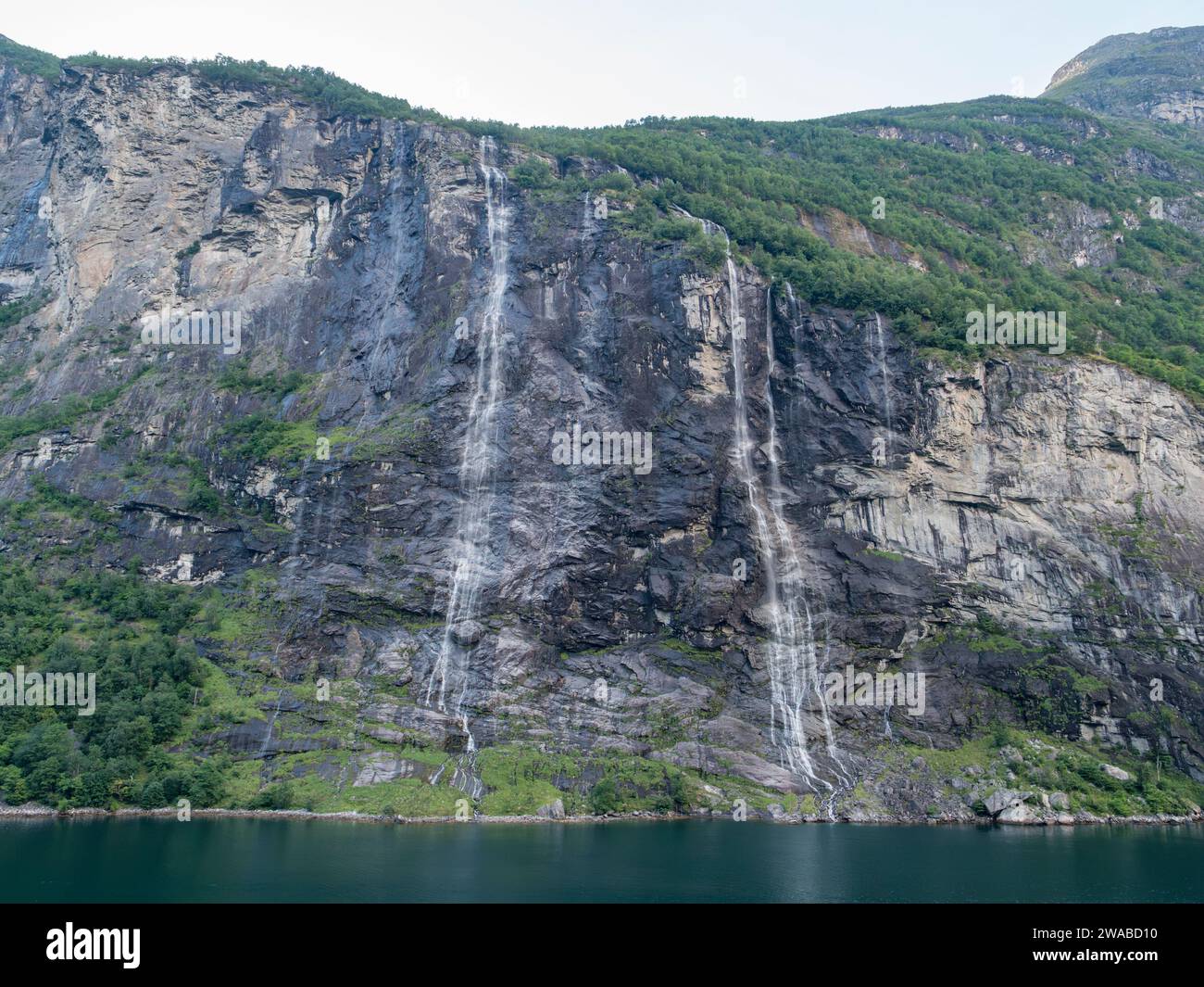 The Seven Sisters (Dei sju systre) waterfalls in Geirangerfjorden near ...