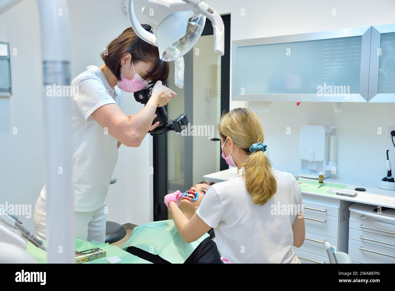 Dentist taking pictures of teeth before teeth whitening procedure