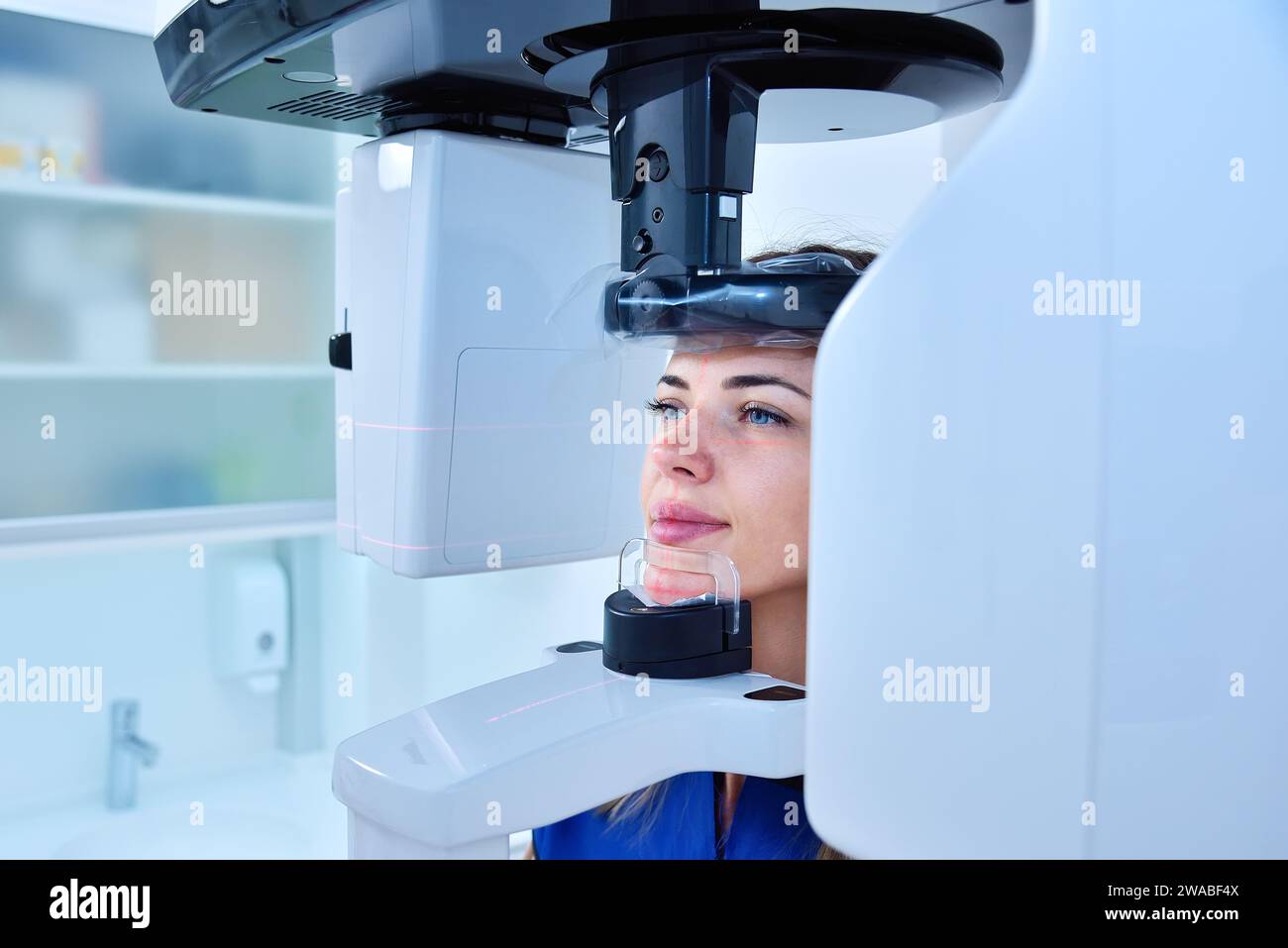 Young woman patient make a dental computer tomograph. Dentistry and health care concept. Close up Stock Photo