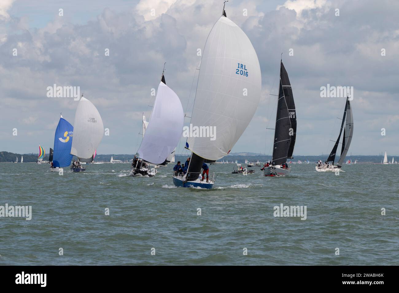 A group of Sailing Yachts at close quarters during a sailboat race during the Cowes Week Regatta. Cowes Week is an annual event held on the IOW Stock Photo