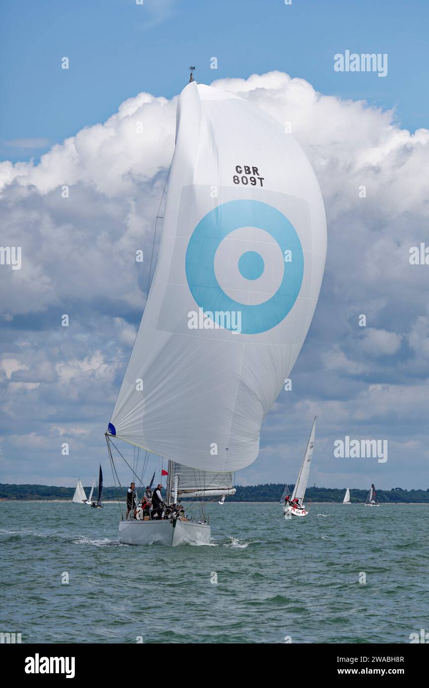 Sailing Yacht Eager GBR809T sails along the Solent as she competes in the Cowes Week Regatta in the Solent off the South coast off England Stock Photo