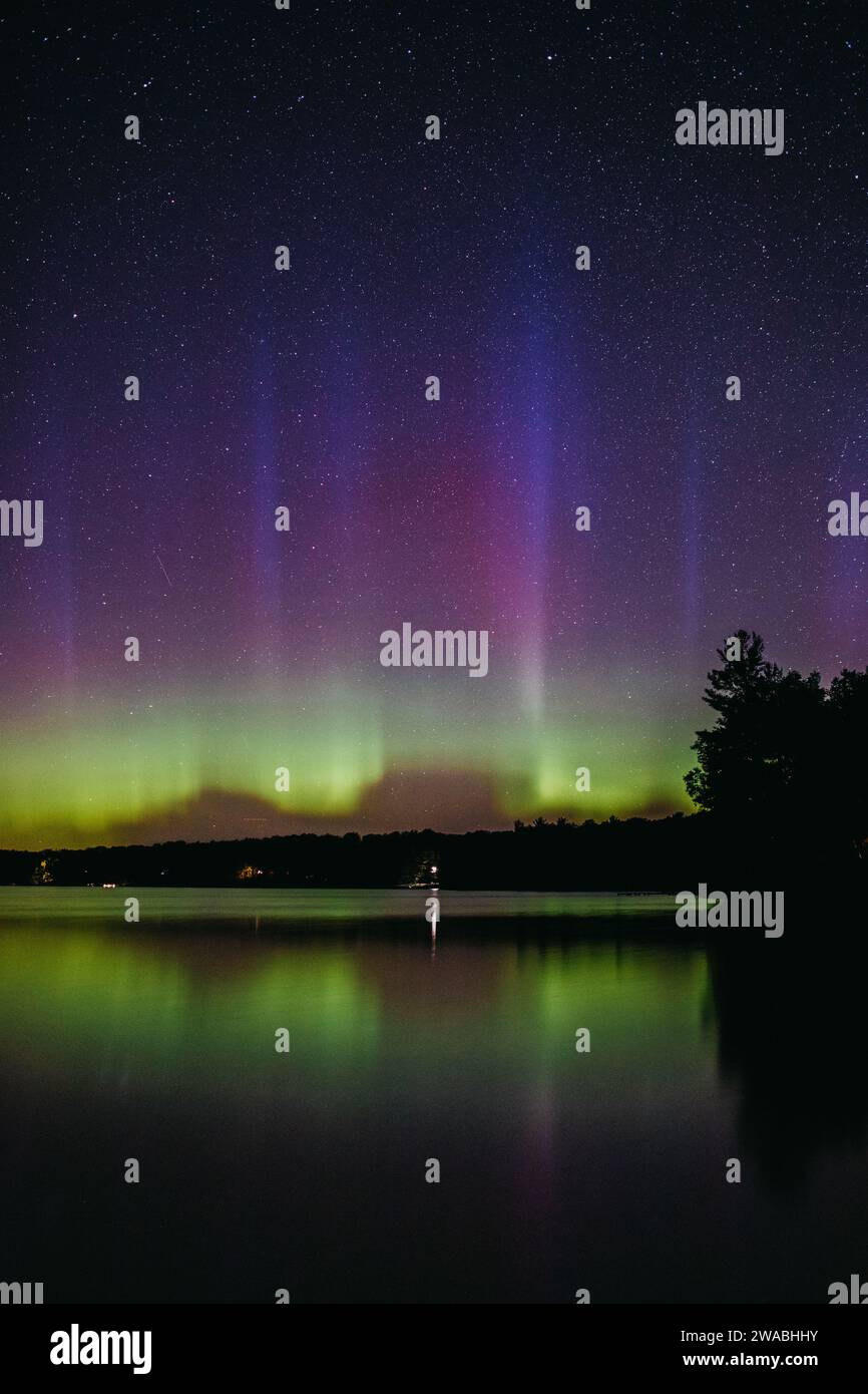 The Northern Lights dancing over a lake in Michigan Stock Photo - Alamy