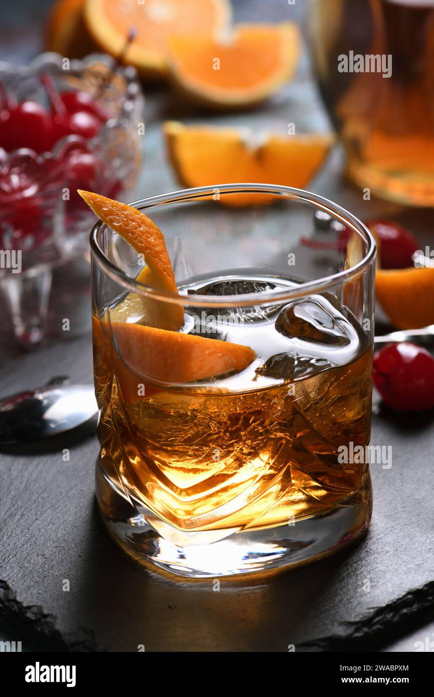 The Irish redhead. Whiskey cocktail, grenadine syrup, club soda, lemon or lime juice, garnished with   orange zest, served in scotch class with ice. A Stock Photo
