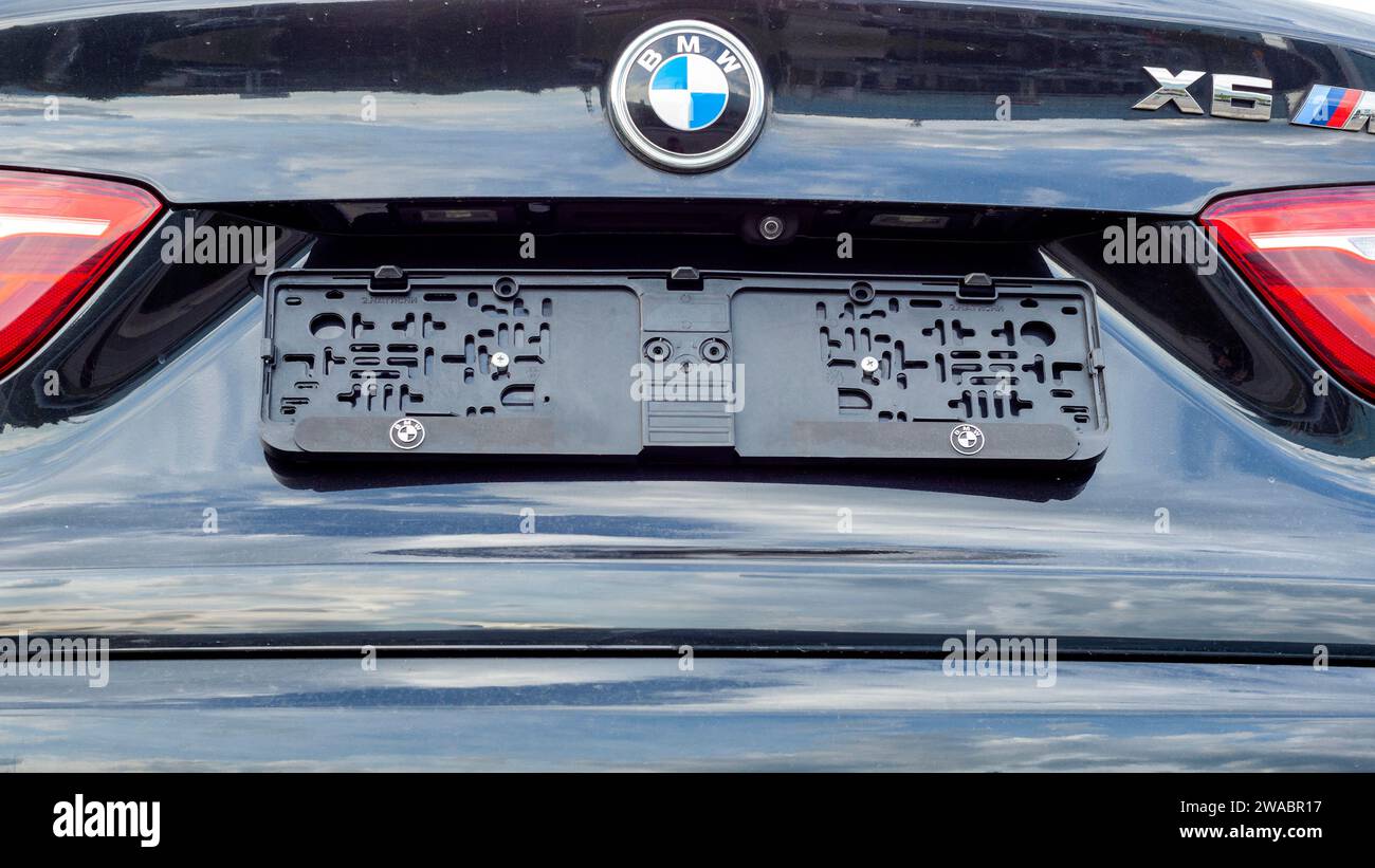 Used BMW X6 M50 second hand car rear view with no number plate on Stock Photo