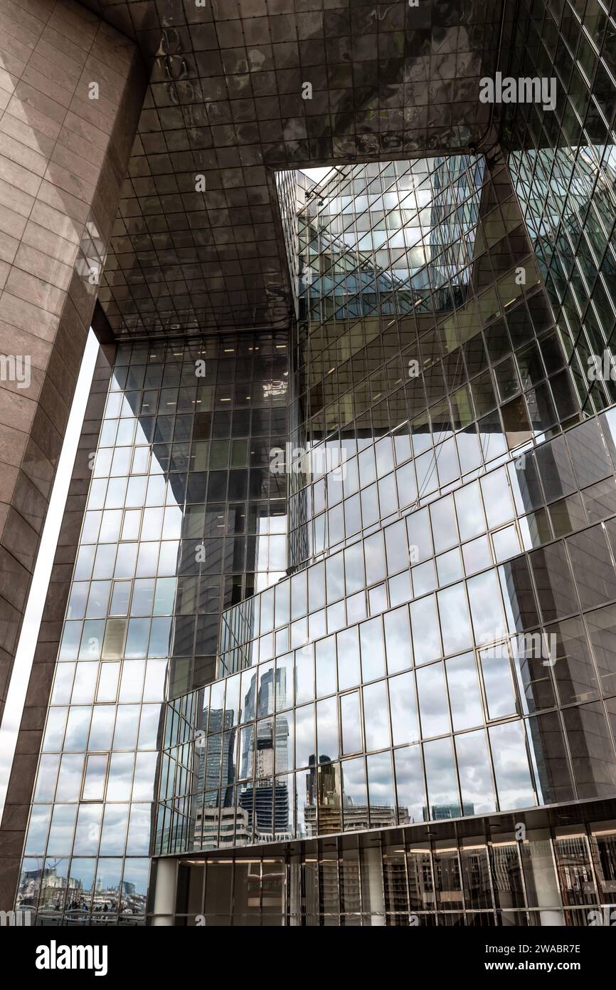 Reflection Of The London Skyline With Skyscrapers In The Glass Facade Of A Modern Office Building Stock Photo