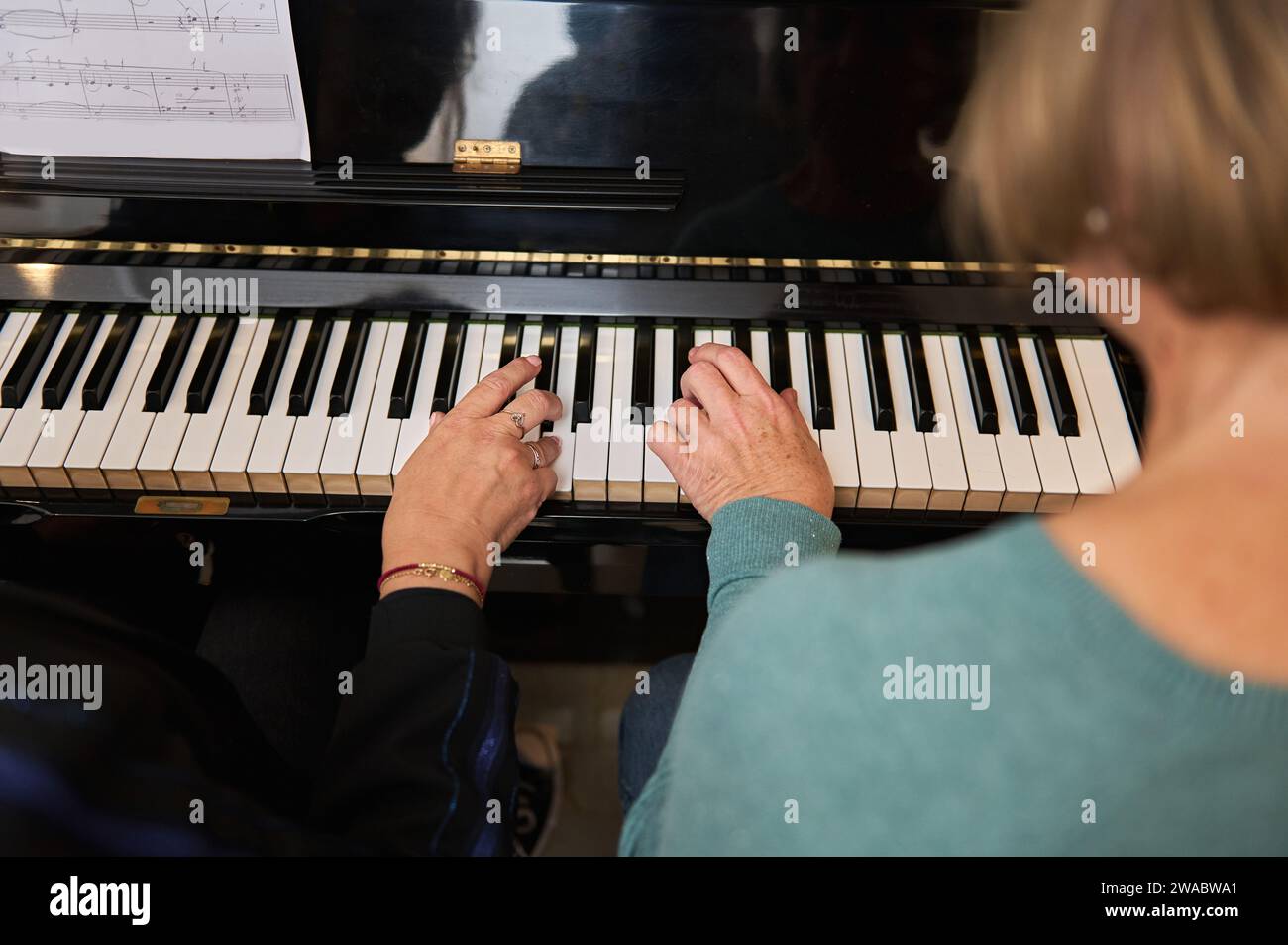 Rear view mature woman playing hi-res stock photography and images - Alamy