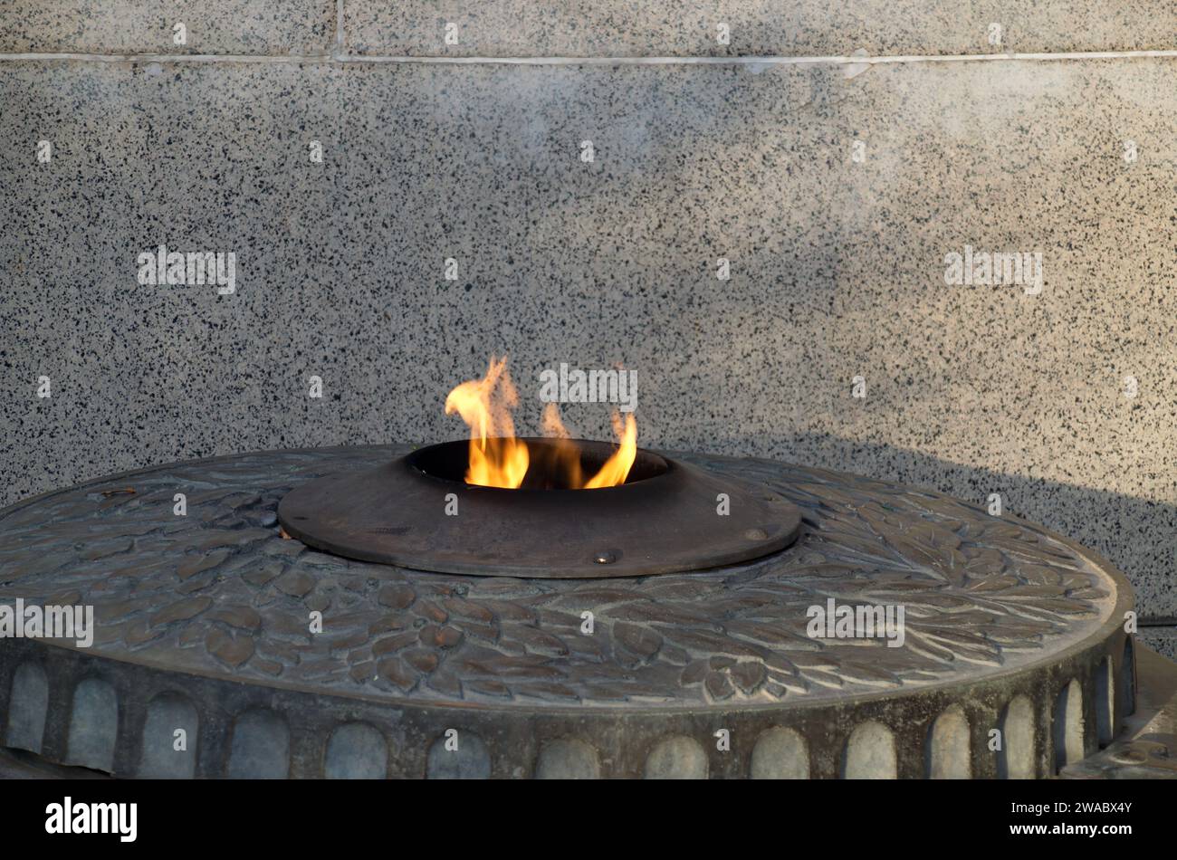 The Eternal Flame at the Monument or Grave to the Unknown Warrior, built in 1981 on the south side of the early Christian church 'St. Sofia' in Sofia, Stock Photo