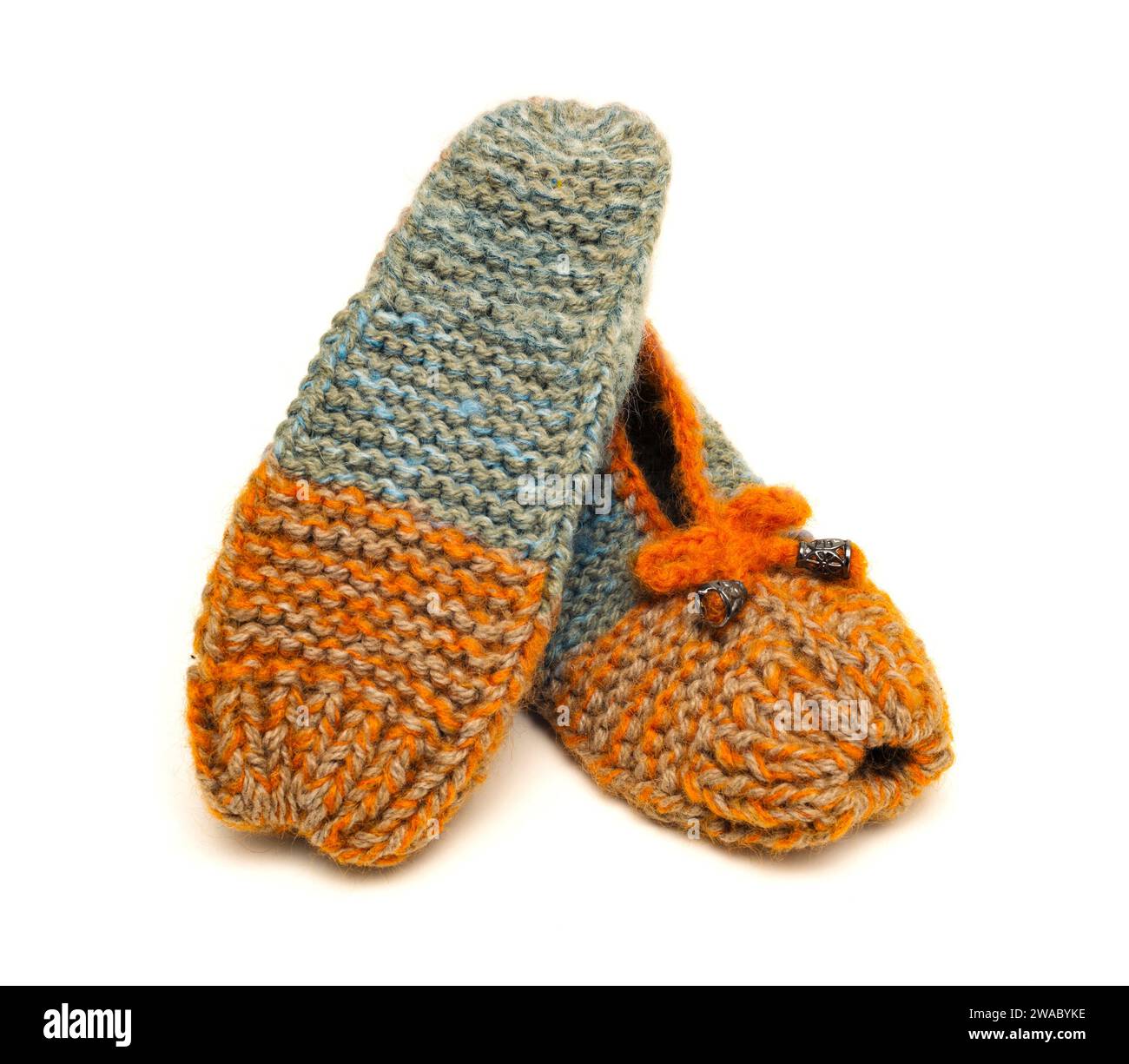 Handmade colorful  made in wool slippers on a white background Stock Photo