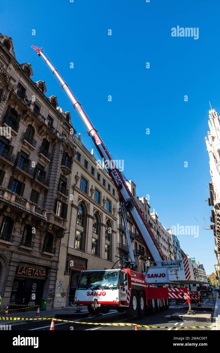 Barcelona, Spain - November 19, 2023: Sanjo brand mobile crane on a street in Via Laietana, Barcelona, Catalonia, Spain Stock Photo