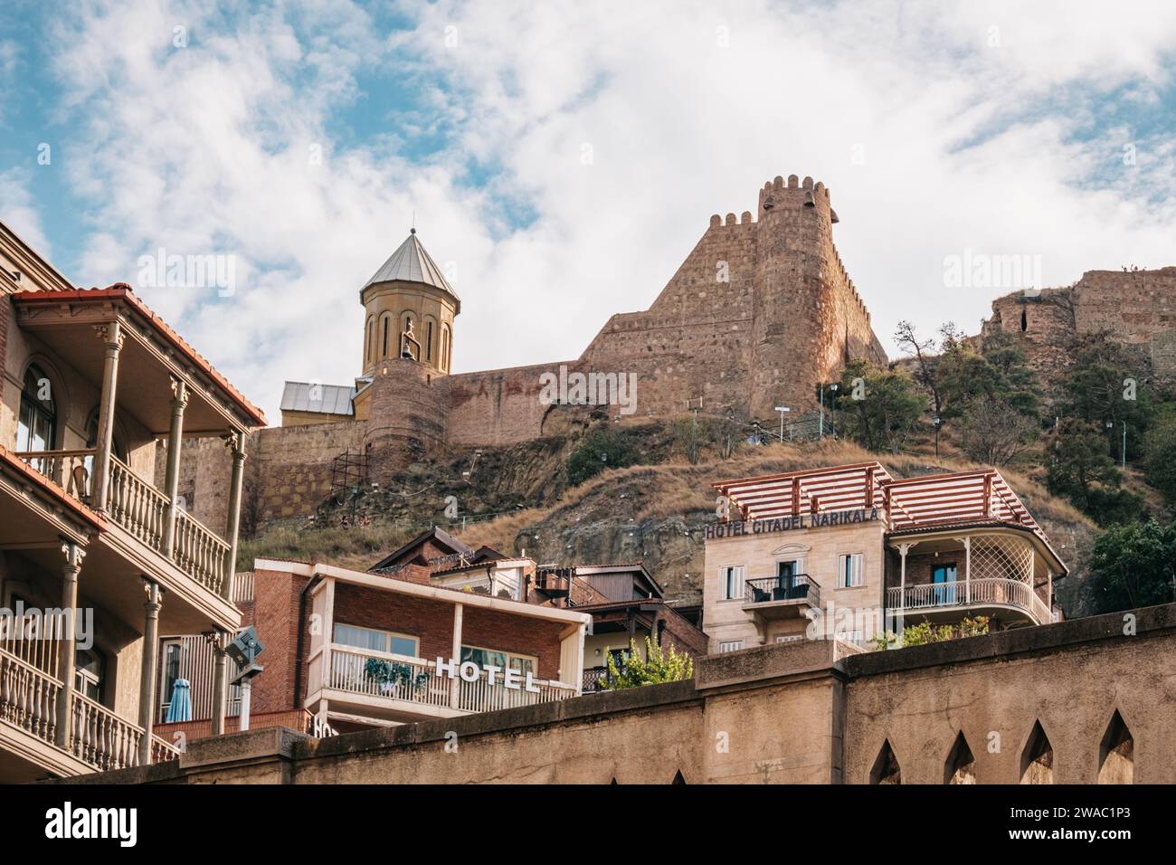 View on the Narikala fortress walls, the Saint Nicholas orthodox church and the wooden balconies of Kala, old town of Tbilisi, Greorgia Stock Photo