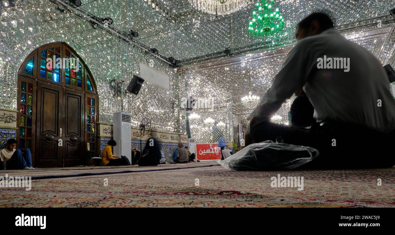 Tehran (Teheran), Iran 06.25.2023: Interior of Emamzadeh Saleh. Shia muslim prays inside mosque Emamzadeh Saleh covered by mirror on the wall. Stock Photo