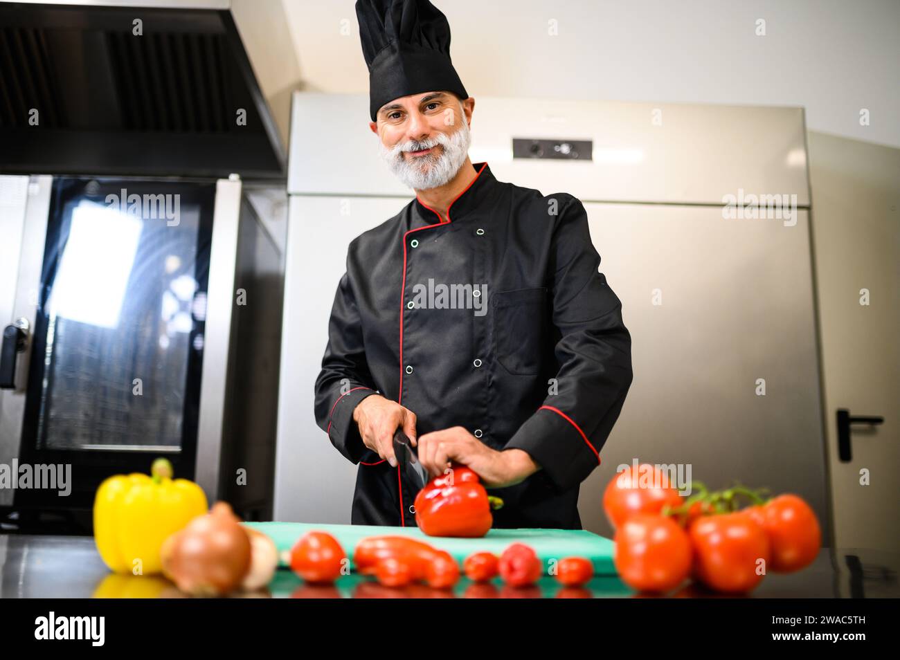 Chef cutting a red pepper Stock Photo