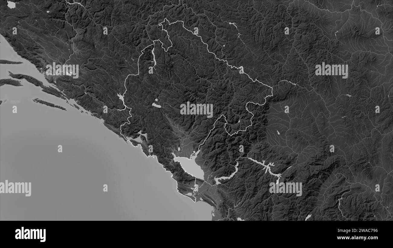 Montenegro outlined on a Grayscale elevation map with lakes and rivers ...