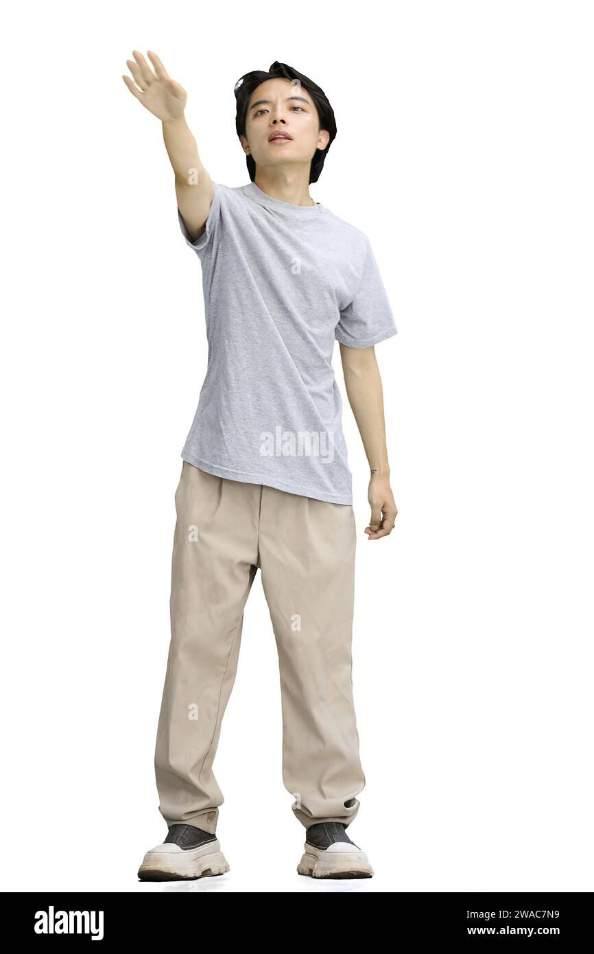 A guy in a gray T-shirt, on a white background, full-length, begging Stock Photo