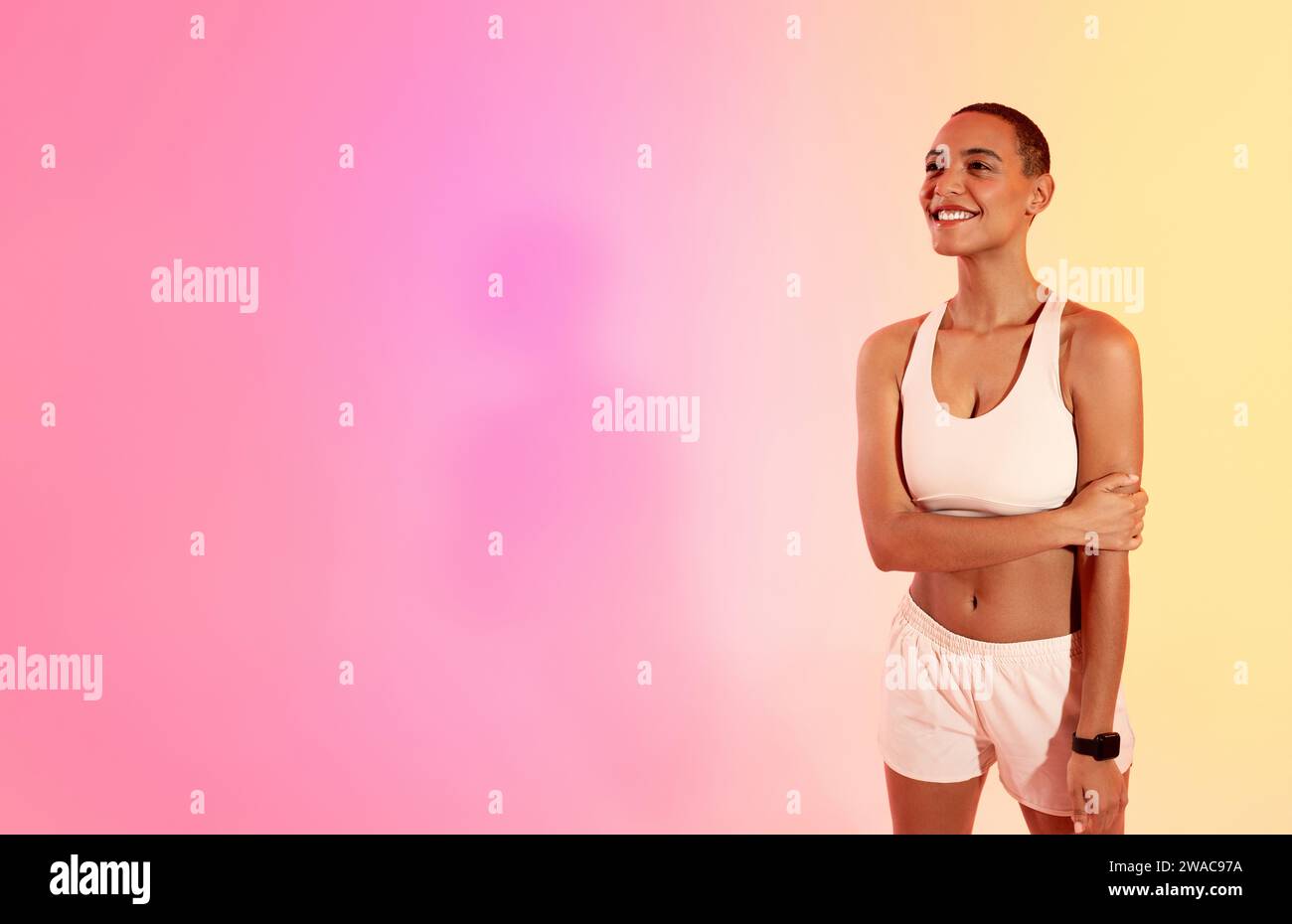 Athletic woman crossed arms hi-res stock photography and images - Alamy