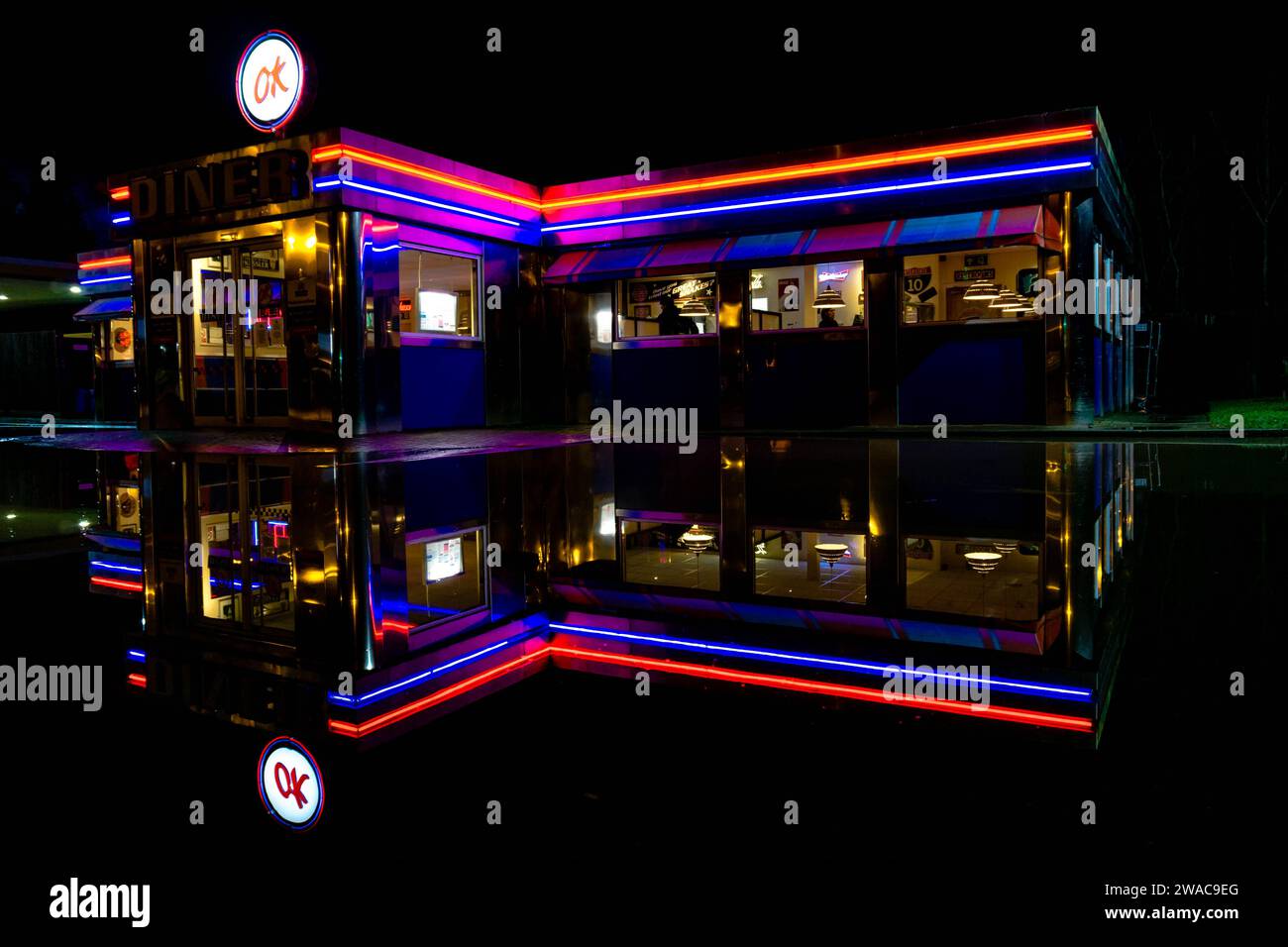 LEOMINSTER - JANUARY 03: The OK Diner in Leominster, Herefordshire is seen reflected in flood water in the aftermath of Storm Henk. Despite the flooding the venue remains open serving customers on January 03, 2024. Stock Photo