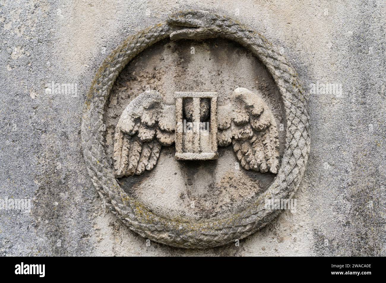 Ancient Christian symbols covering old stone tombs Stock Photo