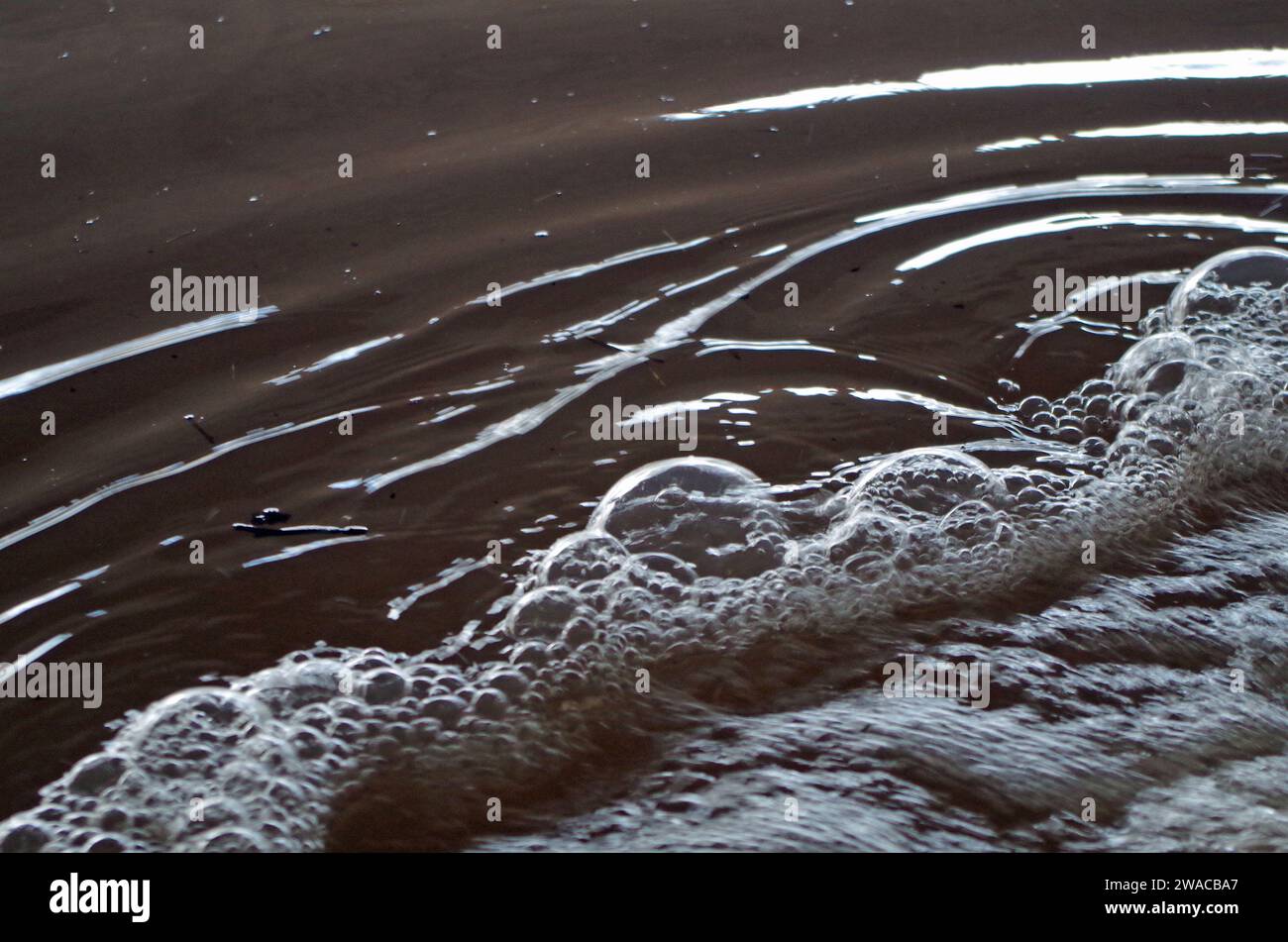 Bubbles at a flood pumping station. Stock Photo