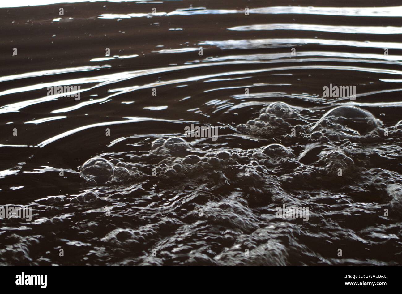 Bubbles at a flood pumping station. Stock Photo