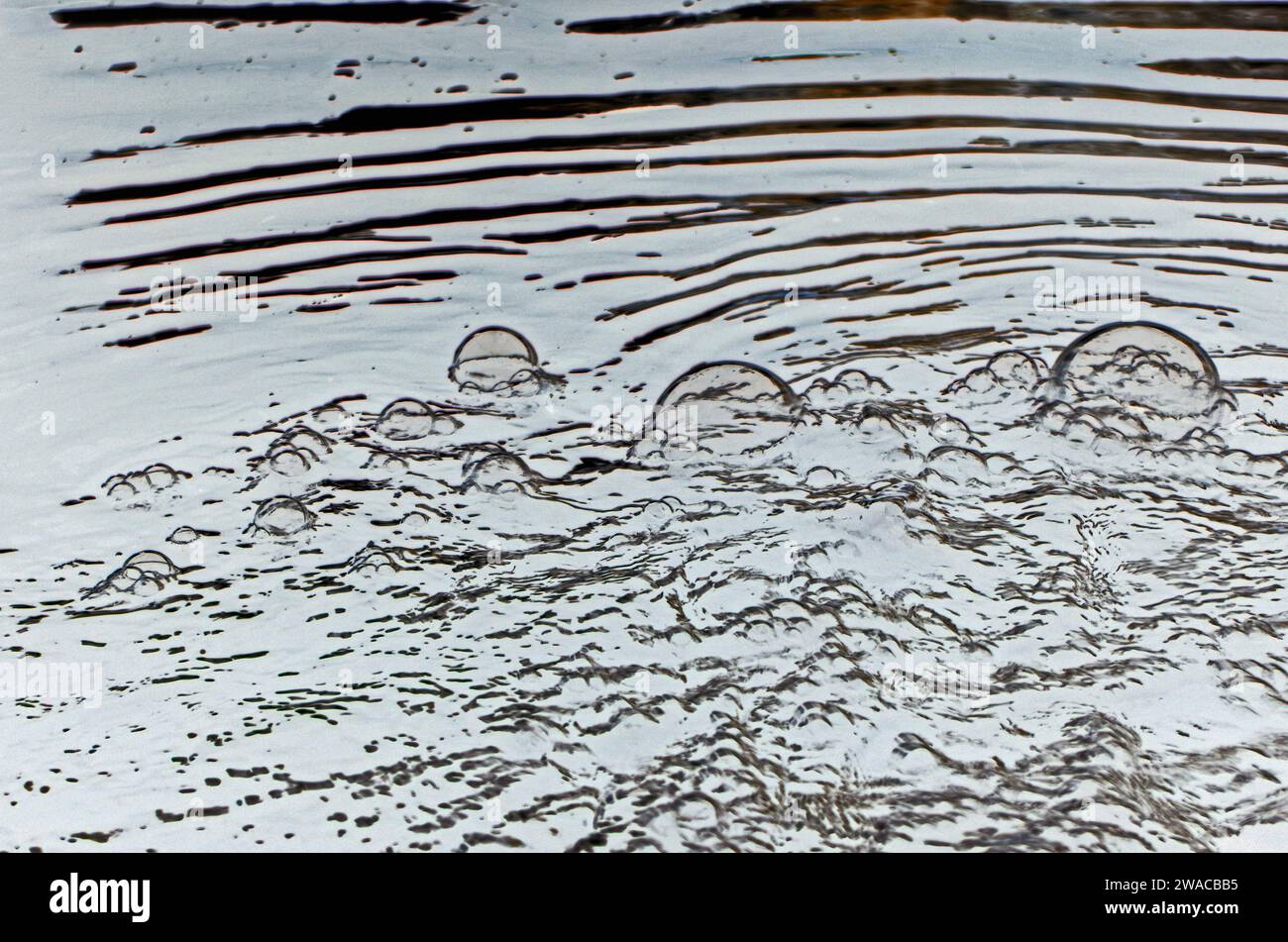 Bubbles at a flood pumping station. Stock Photo