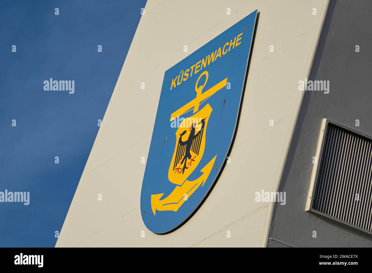 coat of arms of the German Coast Guard on the chimney of a customs boat Stock Photo