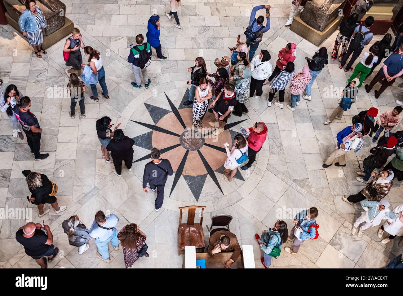 Cairo, Egypt. Top view of tourists at the Cairo National Museum. Top view of hall in museum of Egyptian antiquities in Cairo with many visitors-Decemb Stock Photo