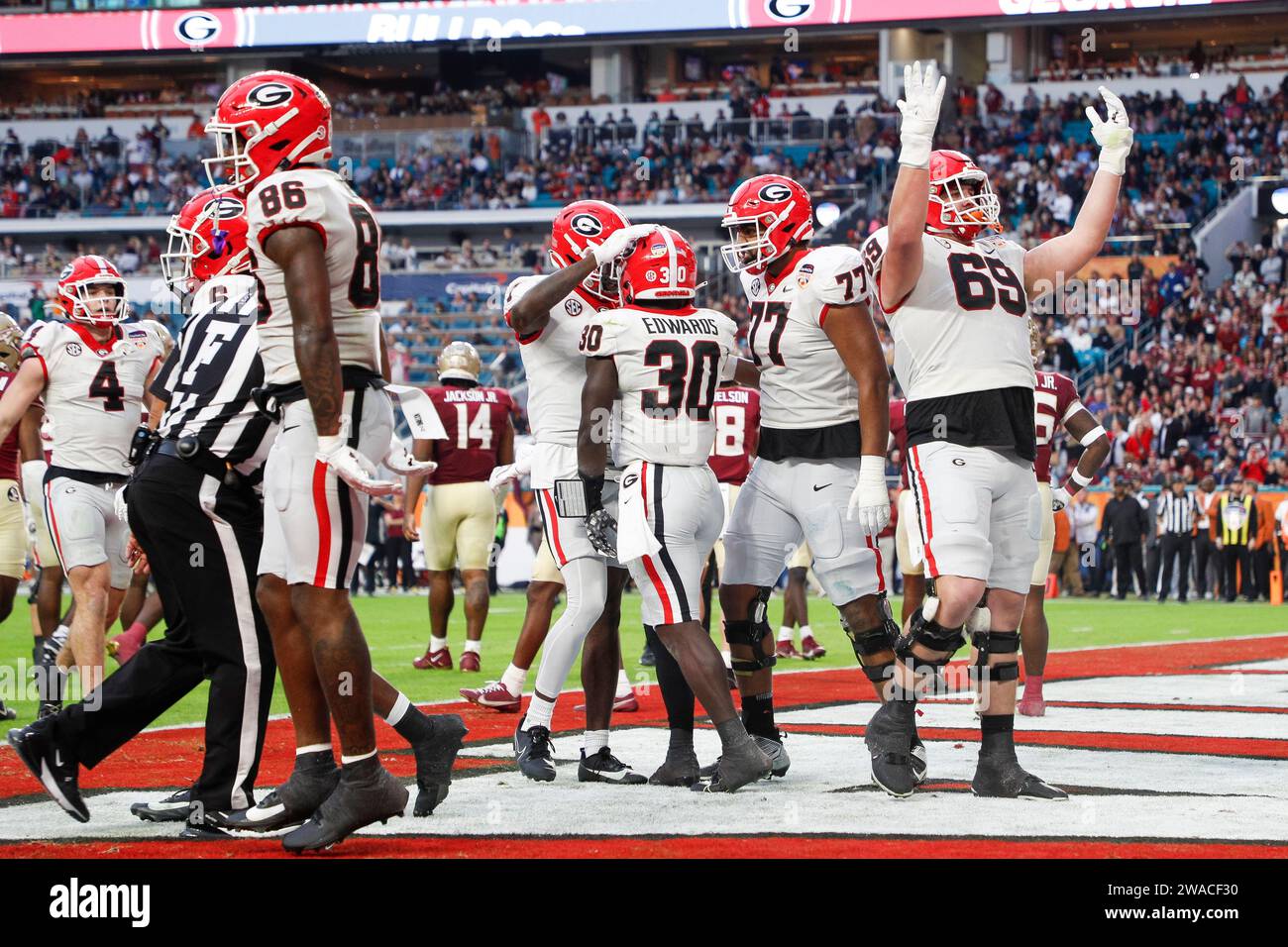 Georgia Bulldogs running back Daijun Edwards (30) celebrates after scoring a touchdown during the Capital One Orange Bowl game against the Florida State Seminoles, Saturday, December 30, 2023, at Hard Rock Stadium in Miami Gardens, FL. (Brandon Sloter/Image of Sport) Stock Photo