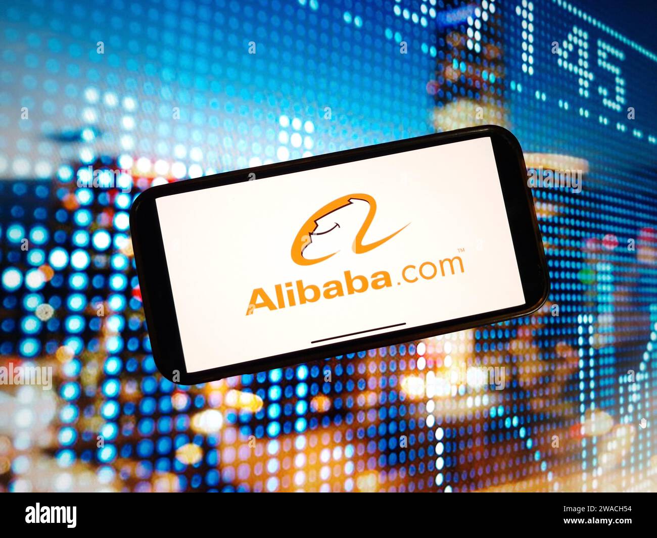 Konskie, Poland - January 03, 2024: Alibaba company logo displayed on mobile phone screen Stock Photo